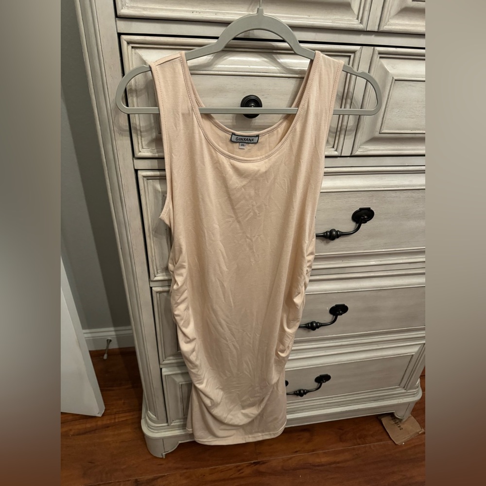 Ruched cream dress. Falls right below knee.